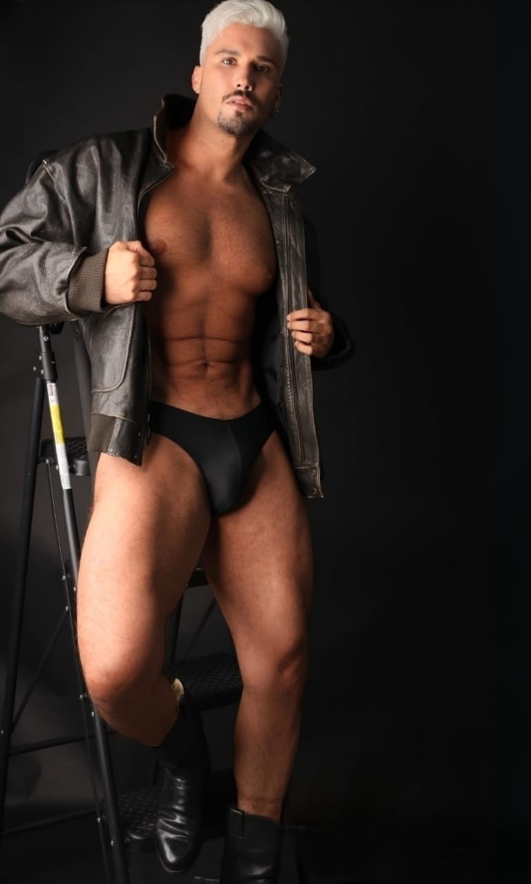 muscular-man-leather-jacket-black-swimsuit